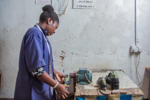 Woman making shoes