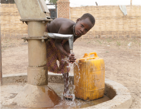 Child at a well in South Sudan.